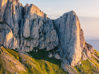 Drone view of Bolshoy Tkhach dolomites mount in Caucasus with sunset or sunrise light