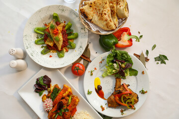 Delicious Indian Cuisine Platter with Naan Bread and Various Dishes