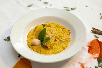 Delicious Creamy Turmeric Fish Curry with Mango and Mint Garnish