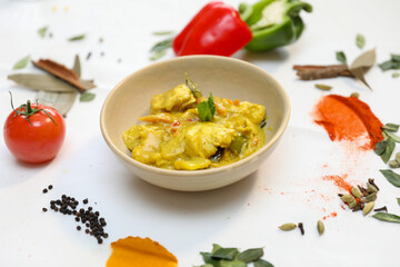 Delicious Chicken Curry in a Bowl with Fresh Spices