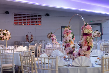 Elegant Wedding Reception Venue Decor with Pink Flower Arrangements