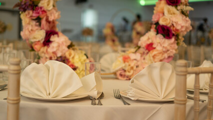 Elegant Wedding Reception Table Setting with Floral Decor