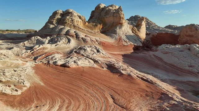 Sunset flyover of red and white sandstone, high buttes at White Pocket
