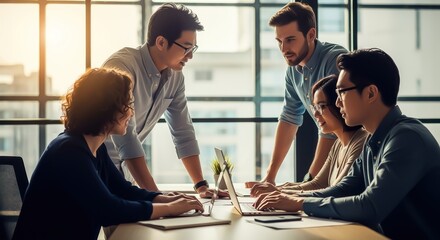 Diverse group of young professionals discussing a project in a modern office