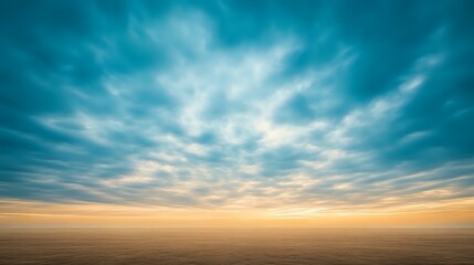 Obraz premium Dramatic turquoise and golden sky with dynamic cloud formations stretching over endless horizon at sunset, creating atmospheric moody landscape for nature backgrounds.