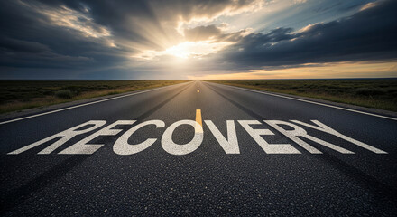 Asphalt road stretching towards sunset, word "RECOVERY" painted on surface, symbolizing journey to healing and progress