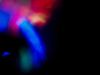 A colorful, blurry background with a rainbow of colors. The colors are bright and vibrant, creating...
