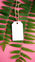 Blank White Tag with Fern Leaves on Pink Background vertical