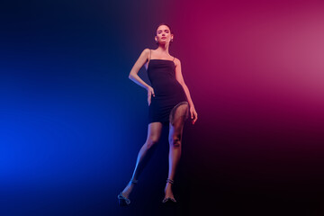 Full length photo of shiny gorgeous lady wear seductive look enjoy ballroom dance isolated blue...