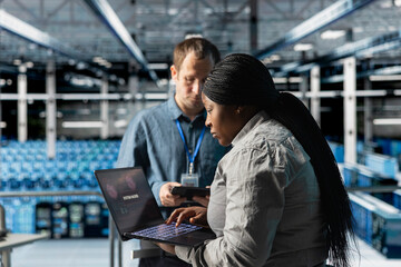 Server farm admins reviewing logs for anomaly detection after hacking attempt. Data center IT...