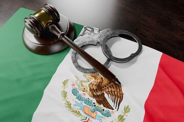Gavel and Handcuffs Resting on Mexican Flag.