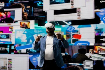 African american tech user immersed in visual environment with VR glasses, representing communication, e commerce and online entertainment. Social networking powered by digital tools.