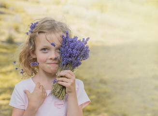 Curious Child with Lavender Bouquet. A young girl with blonde, curly hair and a curious expression...