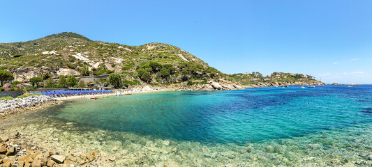 View to Cannelle beach, Spiaggia delle Cannelle, near Giglio Porto with view to mediterranean sea and beautiful blue bay at Isola del Giglio, island of the tuscan archipelago, Grosseto Tuscany Italy