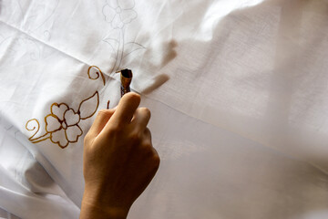 The process of making batik cloth. Batik is a type of cloth whose motifs are made manually,...