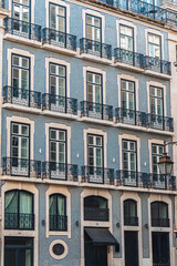 Elegant Lisbon architecture featuring blue azulejo tiles, classic iron balconies, and tall windows. Perfect for travel, culture, and European cityscape design inspiration.