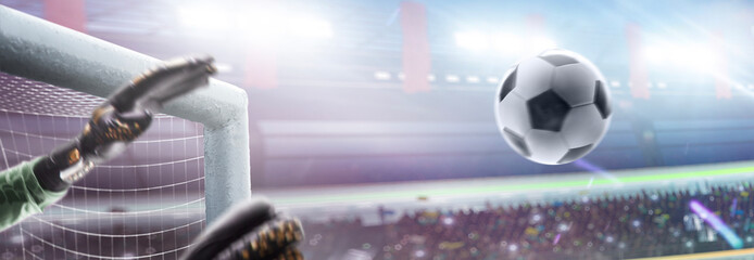 Soccer. The ball flies straight into the goal. The goalkeeper's hands are moving, trying to catch the ball. Close-up. Arena full of cheering fans. Panorama