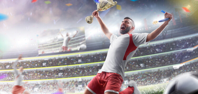 Football winner. Professional football player celebrates victory at an open stadium. Sports emotions. Football player holds a cup and a medal in his hands. Confetti - Powered by Adobe