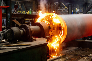 Iron pipe centrifugal pipe casting, new red hot freshly cast iron pipe at the foundry