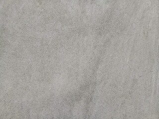 Fototapeta premium Abstract background of smooth textured cement floor surface close up.