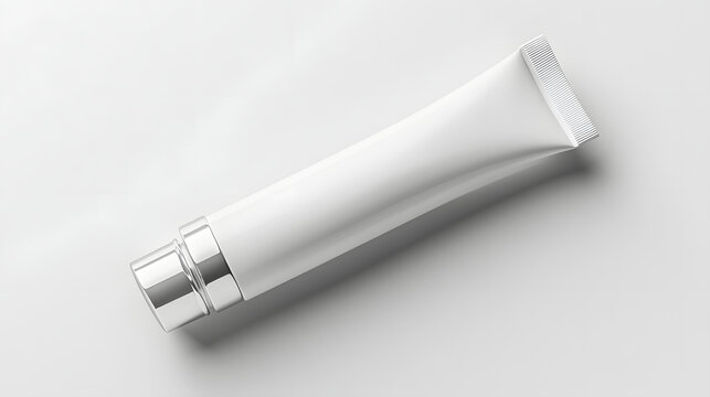 Sleek white matte cosmetic tube with silver cap lies on smooth surface, ideal for skincare or beauty product mockups. minimalist design exudes elegance and simplicity