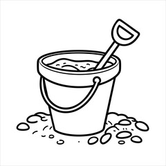 A filled sand bucket with a shovel on the beach