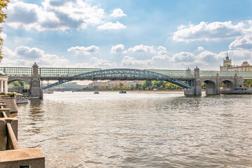 View of the Moscow river embankment, Pushkinsky bridge and cruise ships at sunset.