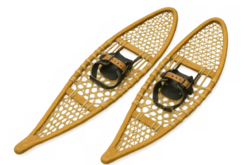 Close-up of vintage snowshoes with leather bindings, showcasing traditional winter footwear against a transparent background