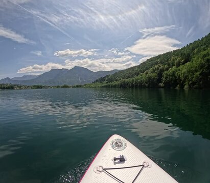 Lake of Levico in Trentino, northern Italy, seen during a hike on a stand up paddle board on a beautiful day in June