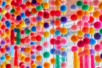 Colorful Pom Pom Garland Hanging as Festive Decor
