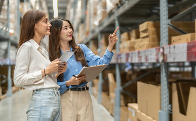 Female engineers team discussing inventory in warehouse logistics and supply chain planning, operation management, data analysis, warehouse shipping, inventory tracking, optimization and technology