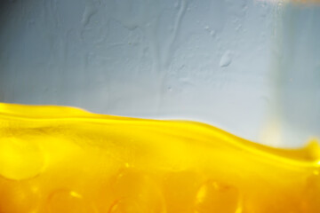 Macro texture of melted fish oil capsule in hot container