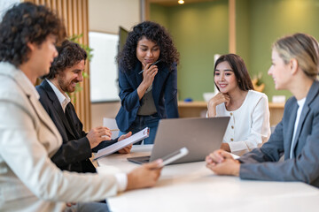 Leadership training, executive communication and team development in progress with diverse professionals in coaching seminar, strategic thinking and interpersonal skills in a modern workplace