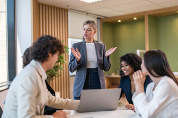 Leadership training, executive communication and team development in progress with diverse professionals in coaching seminar, strategic thinking and interpersonal skills in a modern workplace