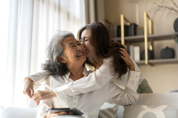Portrait of enjoy happy love asian family senior mature mother and young daughter smiling play...