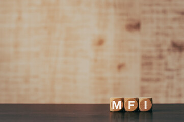 There is wood cube with the word MFI. It is an abbreviation for Mobile First Index as eye-catching...