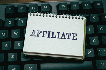 There is wood cube with the word Affiliate. It is as an eye-catching image.