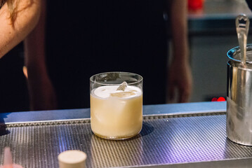 Creamy Cocktail with Ice at Bar Counter.