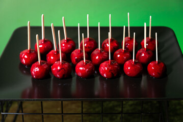 Red Candy Apples on Sticks for Party Display.
