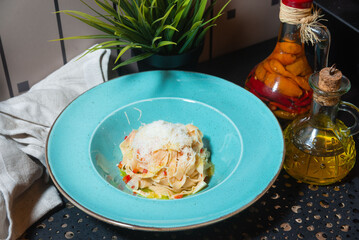 Tagliatelle pasta with parmesan and vegetables.
