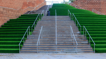Modern Staircase with Green Terraced Design in Urban Landscape