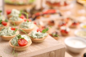 Buffet menu. Tasty stuffed tartlets on stand, closeup