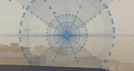 Displaying circular digital gauge with degree marks over rooftop skyline, with silhouetted friends