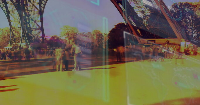 Walking tourists carrying backpacks at Eiffel Tower under lattice pillars, with neon AR overlay