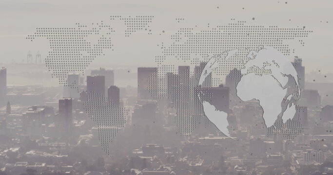 Showing skyscrapers rising above harbor cranes from roof with dot matrix world map, circular globe