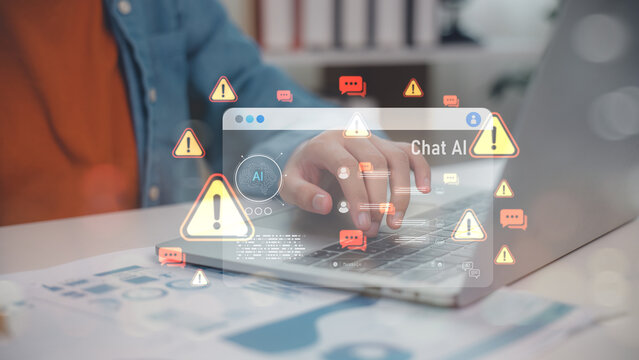 Hand typing on laptop with Chat AI warning icons and alert messages. Represents artificial intelligence risks, chatbot error, misinformation, cyber threat, and AI safety concerns.