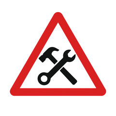 A warning sign with a hammer and wrench, indicating maintenance or repair work ahead.