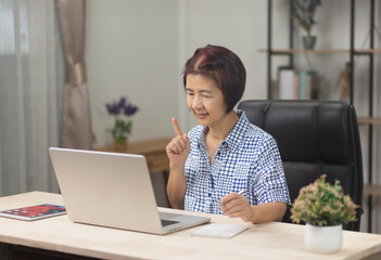 Seniors  woman is learning to upskill  AI technology.