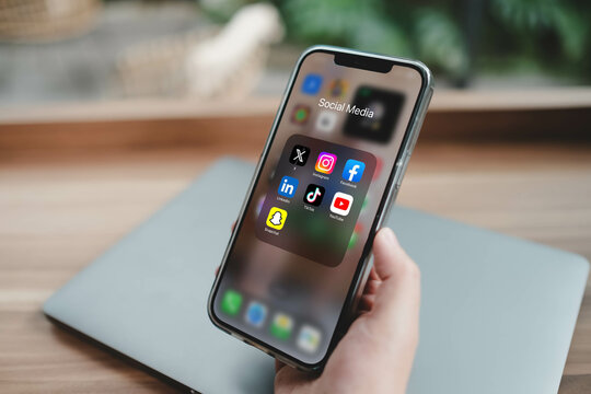 Bangkok, Thailand. June 24, 2025; A smartphone screen displaying a folder of popular social media apps, including X, Instagram, Facebook, TikTok, YouTube, LinkedIn, and Snapchat.
