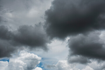 Dramatic dark storm thundercloud rain clouds on black sky background. Dark thunderstorm clouds...